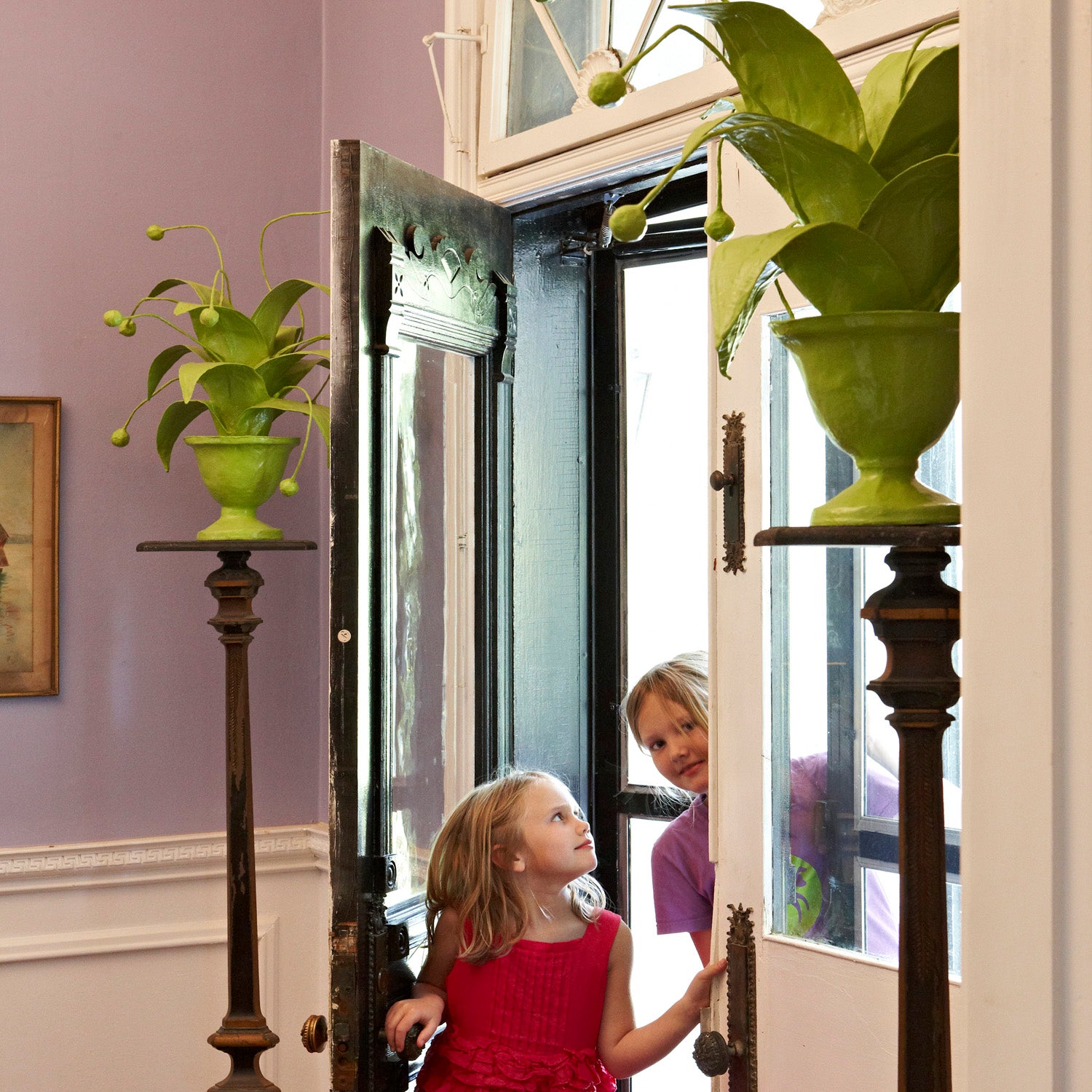 crunchberry papier mache plants flank enchanting entryway